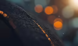blurred images of small orange balls in the dark