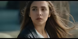 a girl is shown with wind blowing her hair