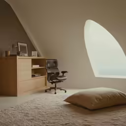 the large room has many pillows and a window in it