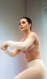 a women that is in some kind of white dress