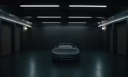 a shiny car is in the dark with the lights on