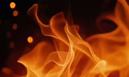 flame tongues coming from a black background