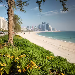 a sandy beach near the ocean next to large buildings