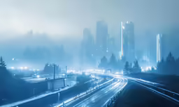 a very blurry city at night with a fog in the air