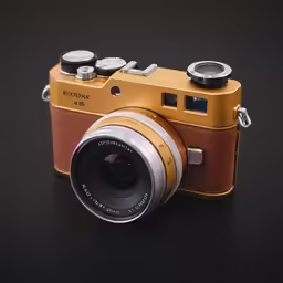a small camera sitting on a black table