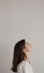 a woman standing up looking to the side