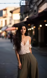 a woman walking down the street in a brown top