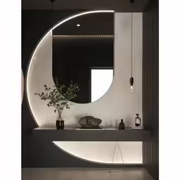 a circular mirror sitting above a long white counter