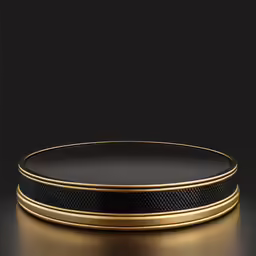 a black and gold plate that is on the ground