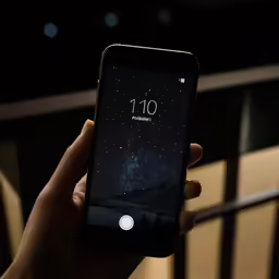 the image is taken of a person using their phone
