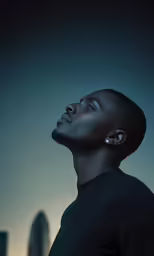 a man is looking upward into the sky