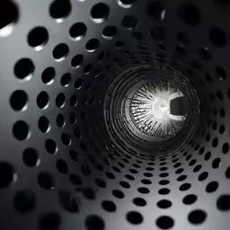 a metal surface with holes in it