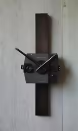 an analog clock is placed on the wall