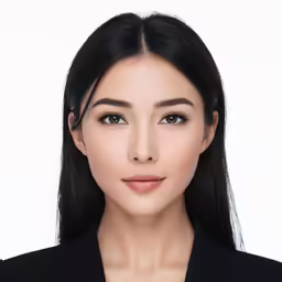 a woman wearing a suit and a necklace