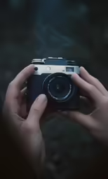 someone taking a photograph with an old digital camera