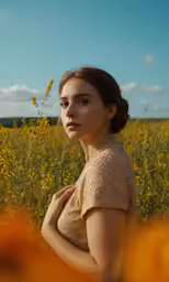 a woman in brown is standing in a field