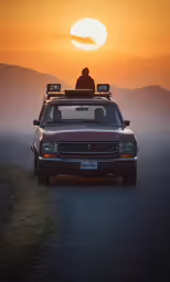 a car with two lights on top at sunset
