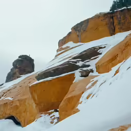 two snow boarders going down the snowy slopes