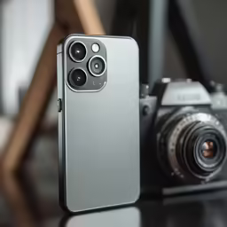 the back side of an iphone 11 pro and a camera