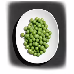 a white plate with green peas in it