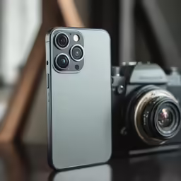 an iphone with three cameras sitting on the table