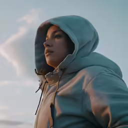 the girl in the hoodie is staring at something