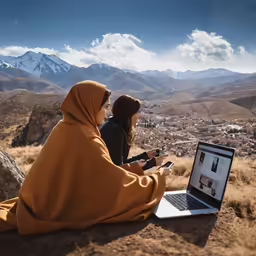 two women sit next to each other and take pictures