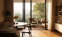 a living room with a table and chairs by the window