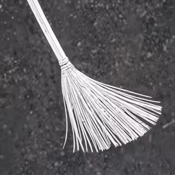 a long white dust broom attached to a pole