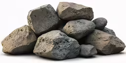 some rocks are piled on each other with a white background