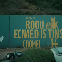 the green wall is labeled with the slogan