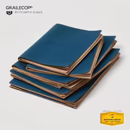 five notebooks stacked on top of each other, with a gold seal
