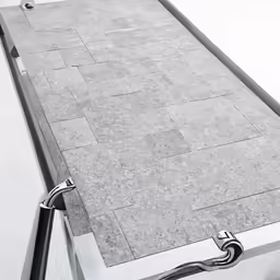 the side of a metal pole with a square design