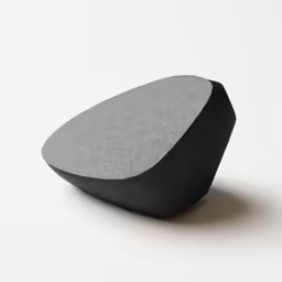 a piece of stone with black and grey shapes