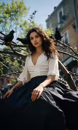 a woman in a white shirt is sitting down on a bench