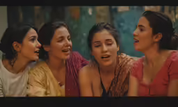 four women are laughing and having fun together