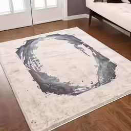 a large area rug with grey brush strokes on a hard wood floor