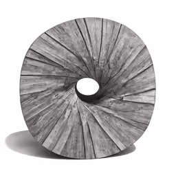 an old weathered spiral shaped object on a white background