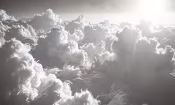 the sun shines brightly through the clouds that appear to float in a cloud