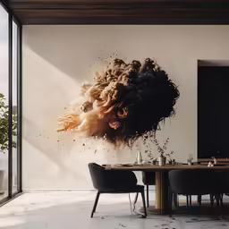 an artistic piece of artwork hanging over a dining room table