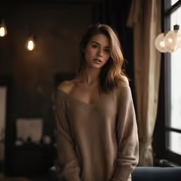 young woman posing for a photograph in a dark room