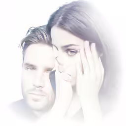 a man and woman are posing for a picture
