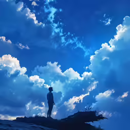 a person standing on a cliff under the cloudy sky