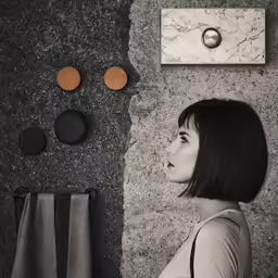 there is a woman in black and white standing in front of a mirror