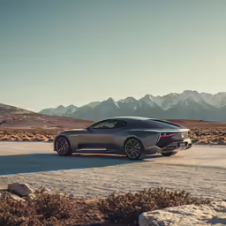 a silver car is parked in the desert