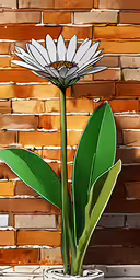 an image of flower with leaves in a vase,a pot with a flower in it against a brick wall