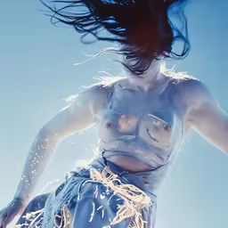 this is an image of a woman in a bikini with wings