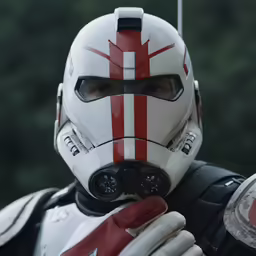 a man is holding two knives and a helmet