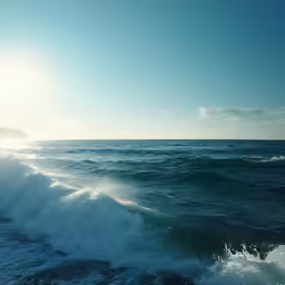 the blue ocean is filled with splashes of water
