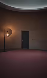 a dimly lit room with large light bulbs, a lamp and a door